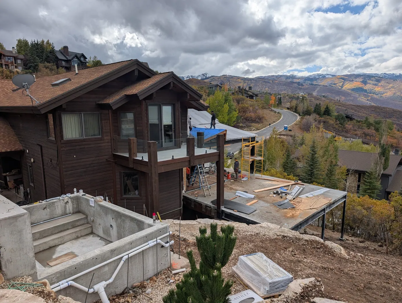 Hillside addition and site structures — Elevated structure, retaining, and a cast concrete spa on a steep lot — several structural systems that all have to land on the same hillside
